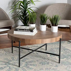Table basse ronde industrielle | Plateau en bois de noyer marron, piétement entrecroisé en métal noir